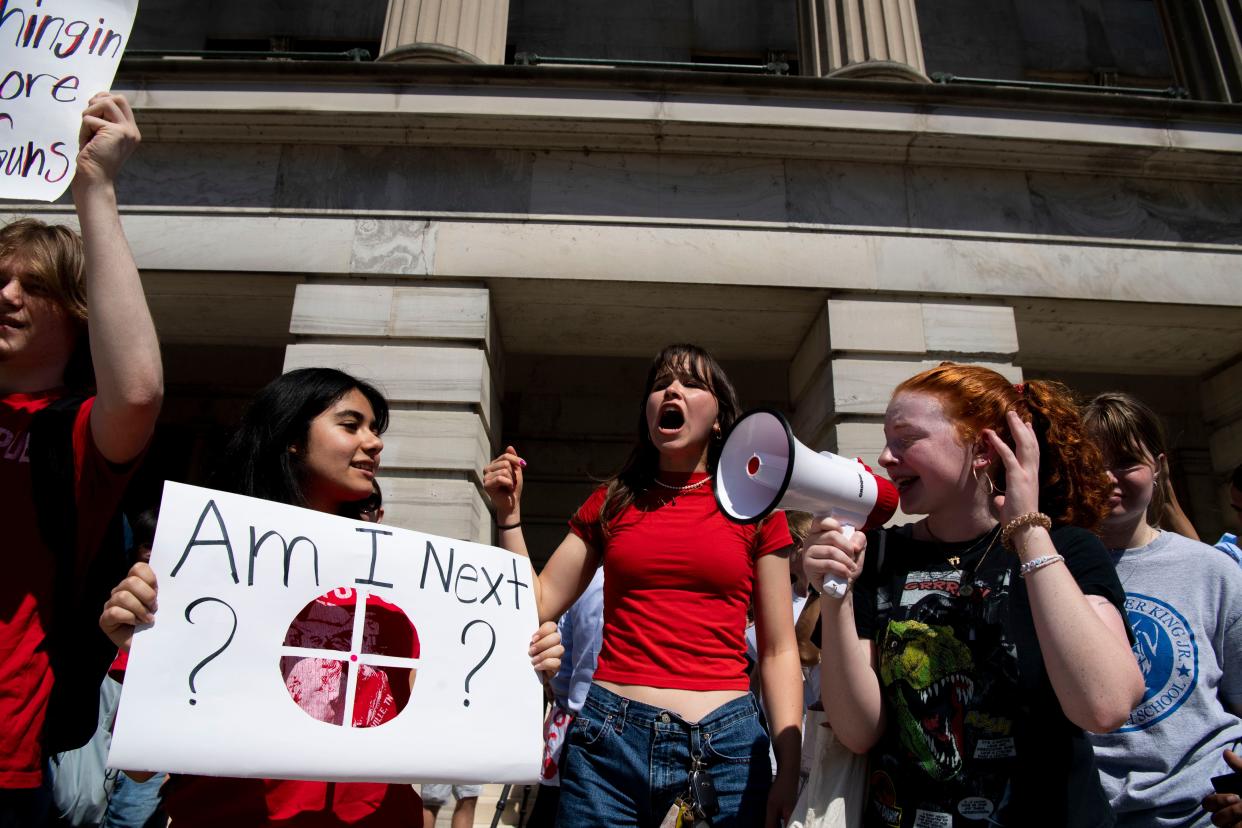 Nashville area high school students gather to protest a bill that would allow teachers to carry firearms at the Tennessee Capitol in Nashville, Tenn., Monday, April 15, 2024.