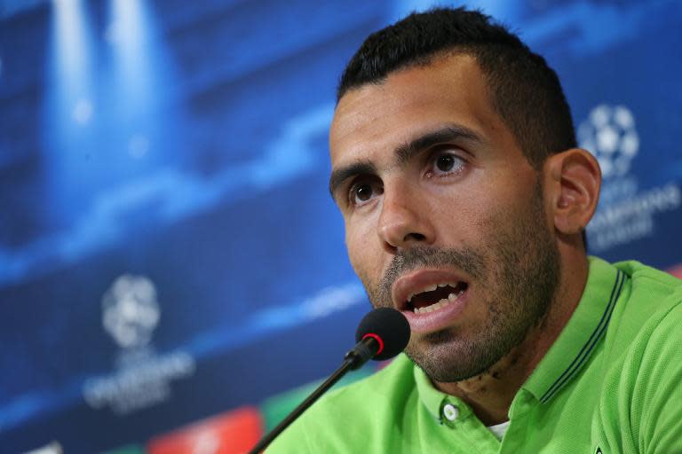 Juventus' forward Carlos Tevez speaks during a press conference on the eve of the UEFA Champions League semi final football match Juventus vs Real Madrid on May 4, 2015