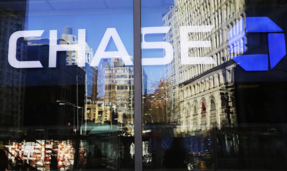 FILE- This Jan. 11, 2016, file photo shows a Chase bank branch in New York. The coronavirus pandemic is weighing heavily on the financial health of JPMorgan Chase. The nation’s largest financial company said Tuesday, July 14, 2020, that it set aside billions of dollars in the second quarter to cover potential losses from all the businesses and consumers who are unable to pay their debts due to the slumping U.S. economy. (AP Photo/Mark Lennihan, File)