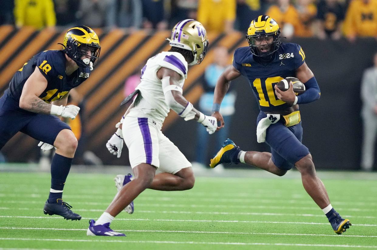 Michigan quarterback Alex Orji runs the ball in the second quarter of the College Football Playoff national championship game against Washington at NRG Stadium in Houston, Texas on Monday, Jan. 8, 2024.