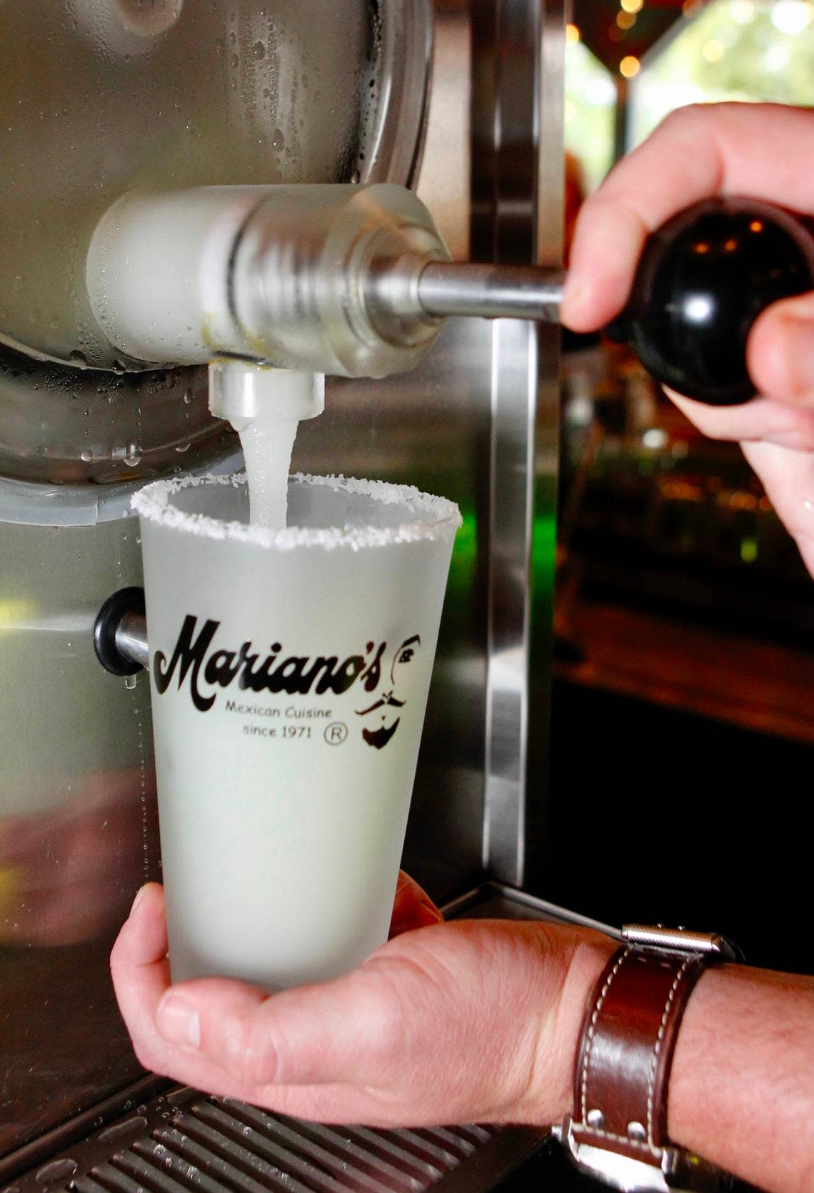 A frozen margarita is dispensed at Mariano’s in Dallas. Mariano Martinez invented the frozen margarita machine 41 years ago.