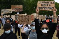 Protestors hold placards during a demonstration in London, on June 3, 2020, after George Floyd, an unarmed black man died after a police officer knelt on his neck during an arrest in Minneapolis, USA. - Londoners defied coronavirus restrictions and rallied on Wednesday in solidarity with protests raging across the United States over the death of George Floyd, an unarmed black man who died during an arrest on May 25. (Photo by DANIEL LEAL-OLIVAS / AFP) (Photo by DANIEL LEAL-OLIVAS/AFP via Getty Images)