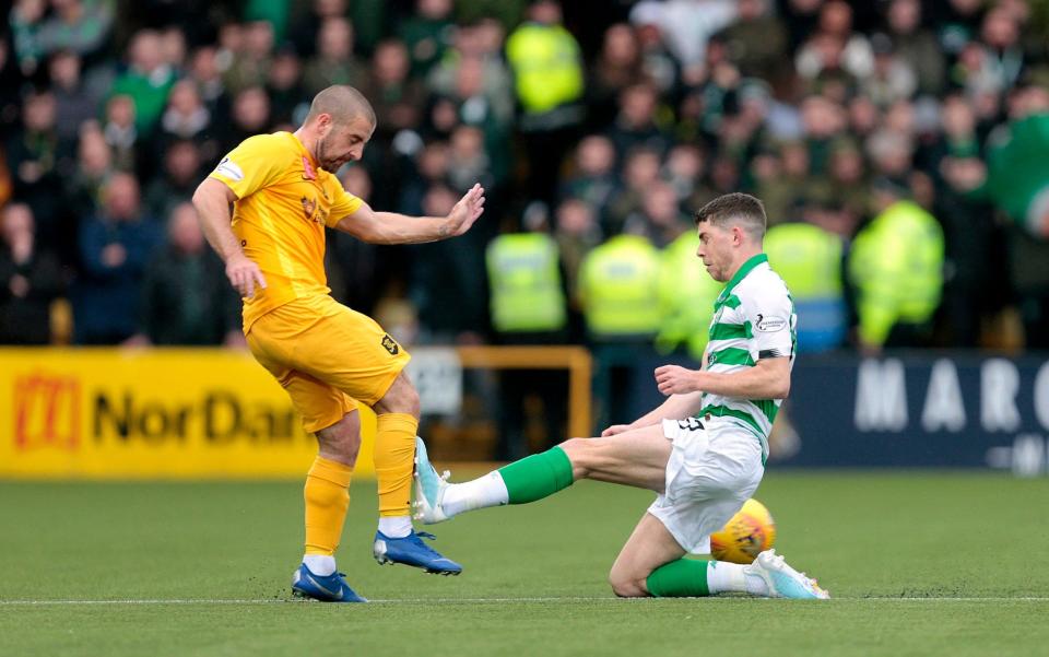 Celtic's Ryan Christie was shown a red card for this studs-up challenge on Livingston's Scott Robinson - PA