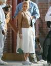 <p>Jennifer Lopez is seen in a leather jacket, a white dress and matching sneakers on the set of a photo shoot in L.A. on Wednesday.</p>