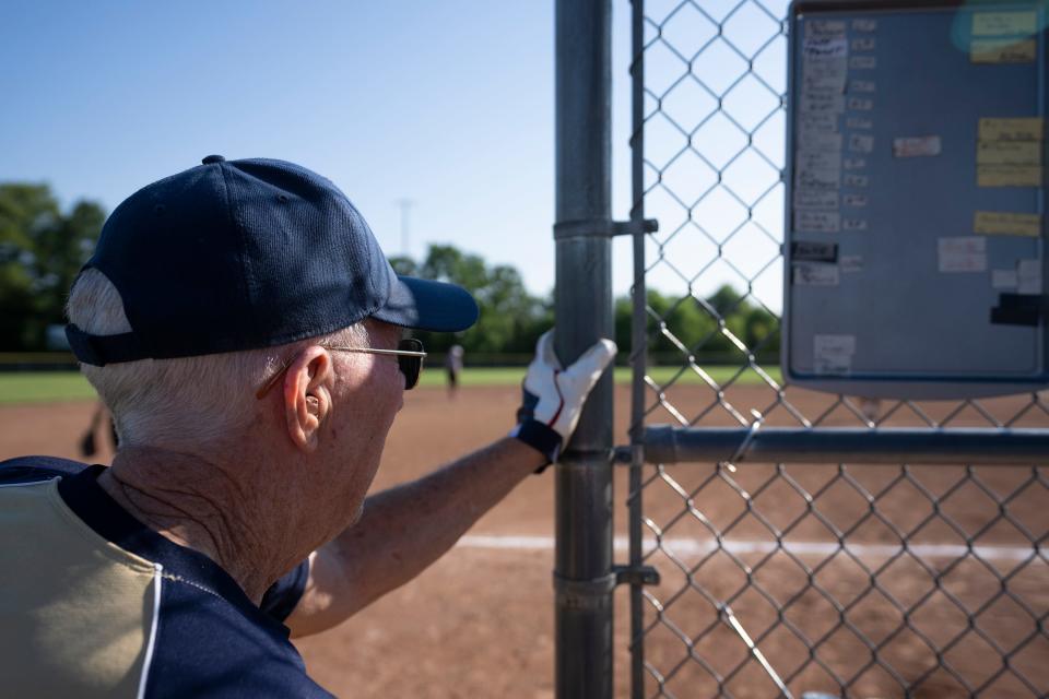 Jul 11, 2023; Hilliard, Ohio, USA;  Phil Peters watches the infield during the Tuesday match of the Central Ohio Senior Softball Association at the Roger A. Reynolds Municipal Park. 