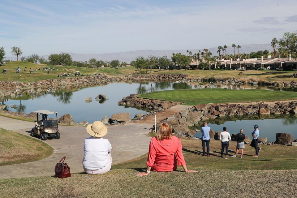 Fans look out on the 17th hole of the Stadium Course at PGA West during a practice round for The American Express.