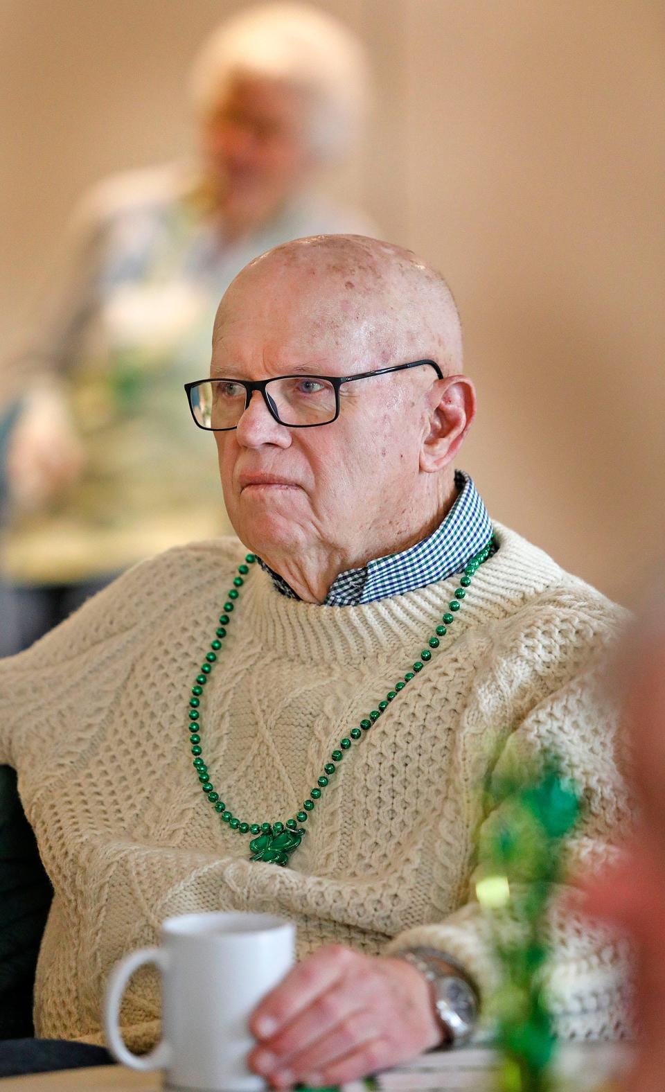 Richard Dwyer, of Scituate, wears an Irish sweater that he has had since the 1960s, during an event about the Scituate St. Patrick's Day Parade's history led by parade Chairman Ed Kelley at the Scituate Senior Center on Tuesday, March 5, 2024.