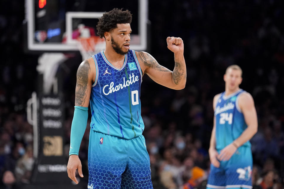 Charlotte Hornets forward Miles Bridges (0) reacts after scoring during the first half of an NBA basketball game against the New York Knicks, Monday, Jan. 17, 2022, in New York. (AP Photo/John Minchillo)