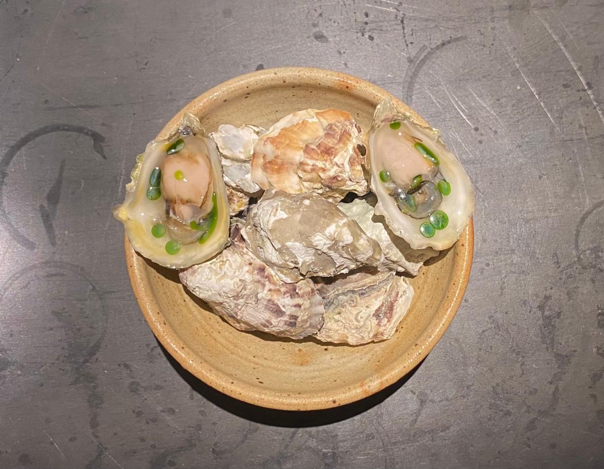 An oyster dish served as part of the snack course at The Den at Nonesuch in Oklahoma City, Okla. June 27, 2024