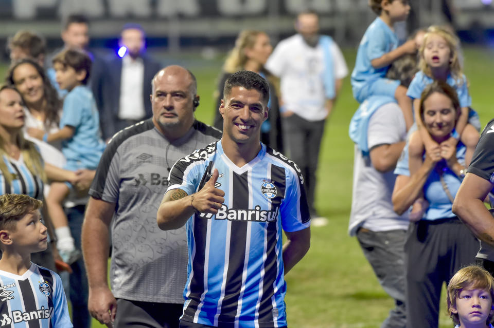 Uruguayan player Luis Suarez gives a thumbs up during his presentation Gremio´s new player during an event at the Gremio Arena stadium, in Porto Alegre, Brazil, Wednesday, Jan. 4, 2023. (AP Photo/Wesley Santos)