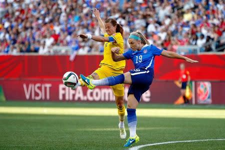 Jun 12, 2015; Winnipeg, Manitoba, CAN; United States defender Julie Johnston (19) and Sweden forward Lotta Schelin (8) battle for the ball during the first half in a Group D soccer match in the 2015 FIFA women's World Cup at Winnipeg Stadium. Mandatory Credit: Michael Chow-USA TODAY Sports