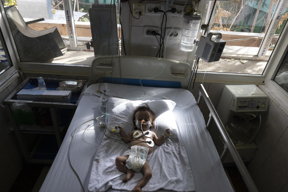 A baby on a bed in the hospital.