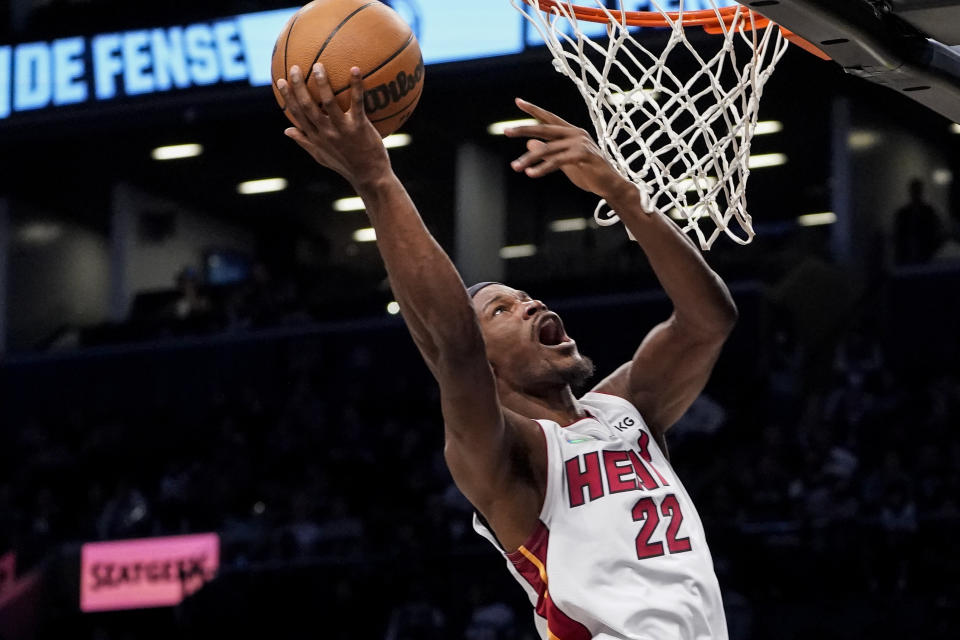 Miami Heat forward Jimmy Butler shoots during the first half of an NBA basketball game against the Brooklyn Nets, Wednesday, Oct. 27, 2021, in New York. (AP Photo/John Minchillo)