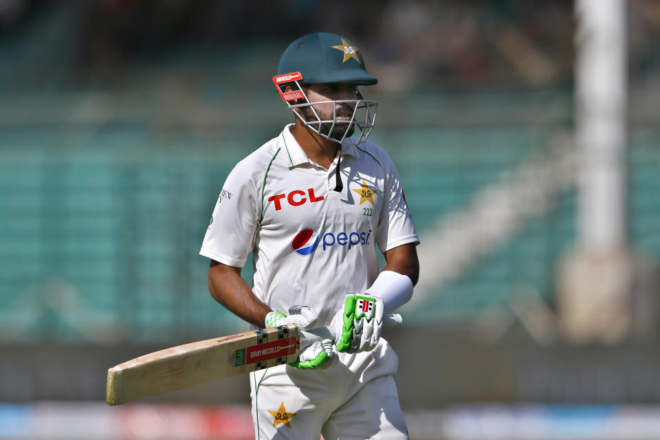 Pakistan Babar Azam reacts after his dismissal on the third day of the second test match between Pakistan and Australia at the National Stadium in Karachi, Pakistan, Monday, March 14, 2022. (AP Photo/Anjum Naveed)