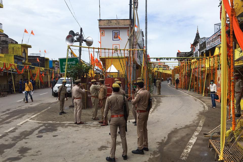 Police stand guard at a road before the arrival of India's Prime Minister to participate in a groundbreaking ceremony of the Ram Temple in Ayodhya on August 5, 2020. - India's Prime Minister Narendra Modi will lay the foundation stone for a grand Hindu temple in a highly anticipated ceremony on August 5 at a holy site that was bitterly contested by Muslims, officials said. The Supreme Court ruled in November 2019 that a temple could be built in Ayodhya, where Hindu zealots demolished a 460-year-old mosque in 1992. (Photo by Sanjay KANOJIA / AFP) (Photo by SANJAY KANOJIA/AFP via Getty Images)