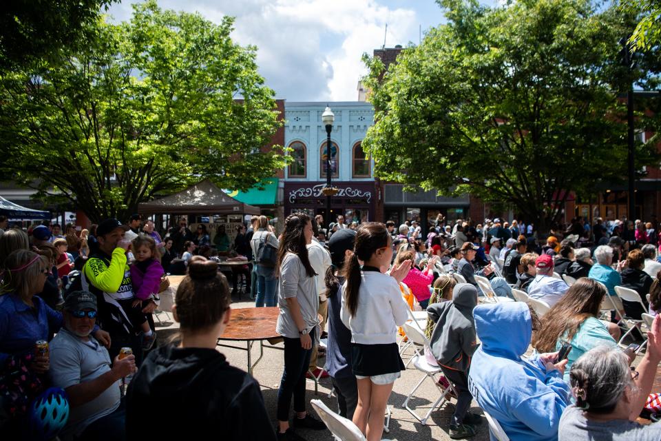 Festival goers enjoy the sights and sounds at the Market Square Stage during Knoxville Opera's Rossini Festival in downtown Knoxville, Tenn. on Saturday, April 22, 2023. The annual international street fair celebrated its 20th year this year. 