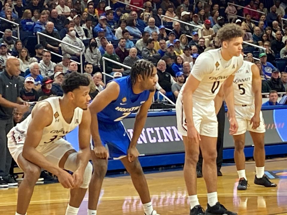 Ody Oguama prepares to rebound (33) alongside UC teammate Dan Skillings Jr. (0) at their NIT game at Hofstra Saturday afternon. Oguama had 14 points and 11 rebounds on the day.