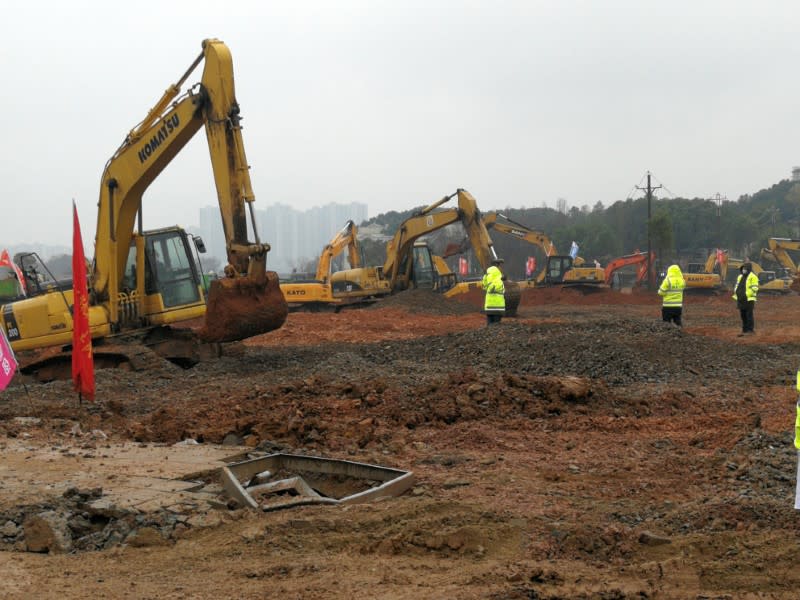 Excavators are seen at the construction site where the new hospital is being built to treat patients of a new coronavirus, following the outbreak and the city's lockdown, on the outskirts of Wuhan