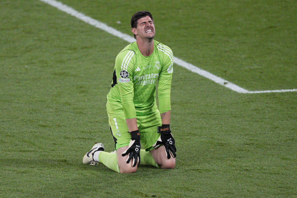 FILE - Real Madrid's goalkeeper Thibaut Courtois celebrates at the end of the Champions League final soccer match between Borussia Dortmund and Real Madrid at Wembley stadium in London, Saturday, June 1, 2024. The most feared striker in Europe won’t be playing at the European Championship. That’s because Erling Haaland’s Norway didn’t qualify. Other big names missing from the Euros include Karim Benzema, Marcus Rashford, Mats Hummels and Sandro Tonali. (AP Photo/Dave Shopland, File)