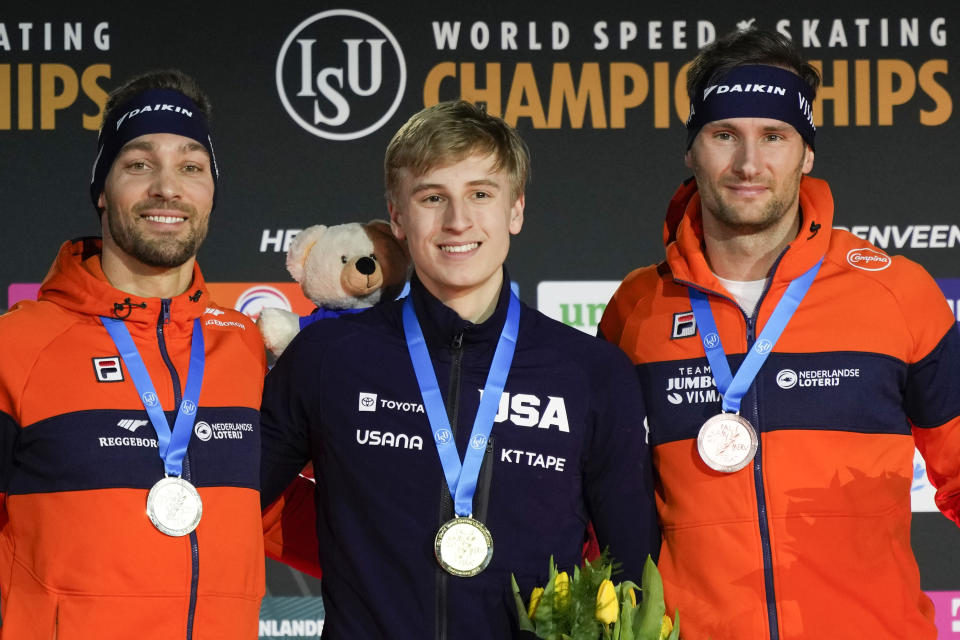 Jordan Stolz of the U.S., center and third gold medal, Kjeld Nuis of the Netherlands, left and silver medal, and Thomas Krol of the Netherlands, right and bronze medal, celebrate on the podium of the 1500m Men event of the Speedskating Single Distance World Championships at Thialf ice arena Heerenveen, Netherlands, Sunday, March 5, 2023. (AP Photo/Peter Dejong)