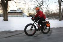 In a Feb. 19, 2014, photo, Fraser Cunningham, 56, of Madeira, Ohio, a General Electric engineer, bicycles home from work in single-digit temperatures. Cunningham hasn't missed a day biking to and from work for a year and a half. (AP Photo/The Cincinnati Enquirer, Carrie Cochran) MANDATORY CREDIT; NO SALES