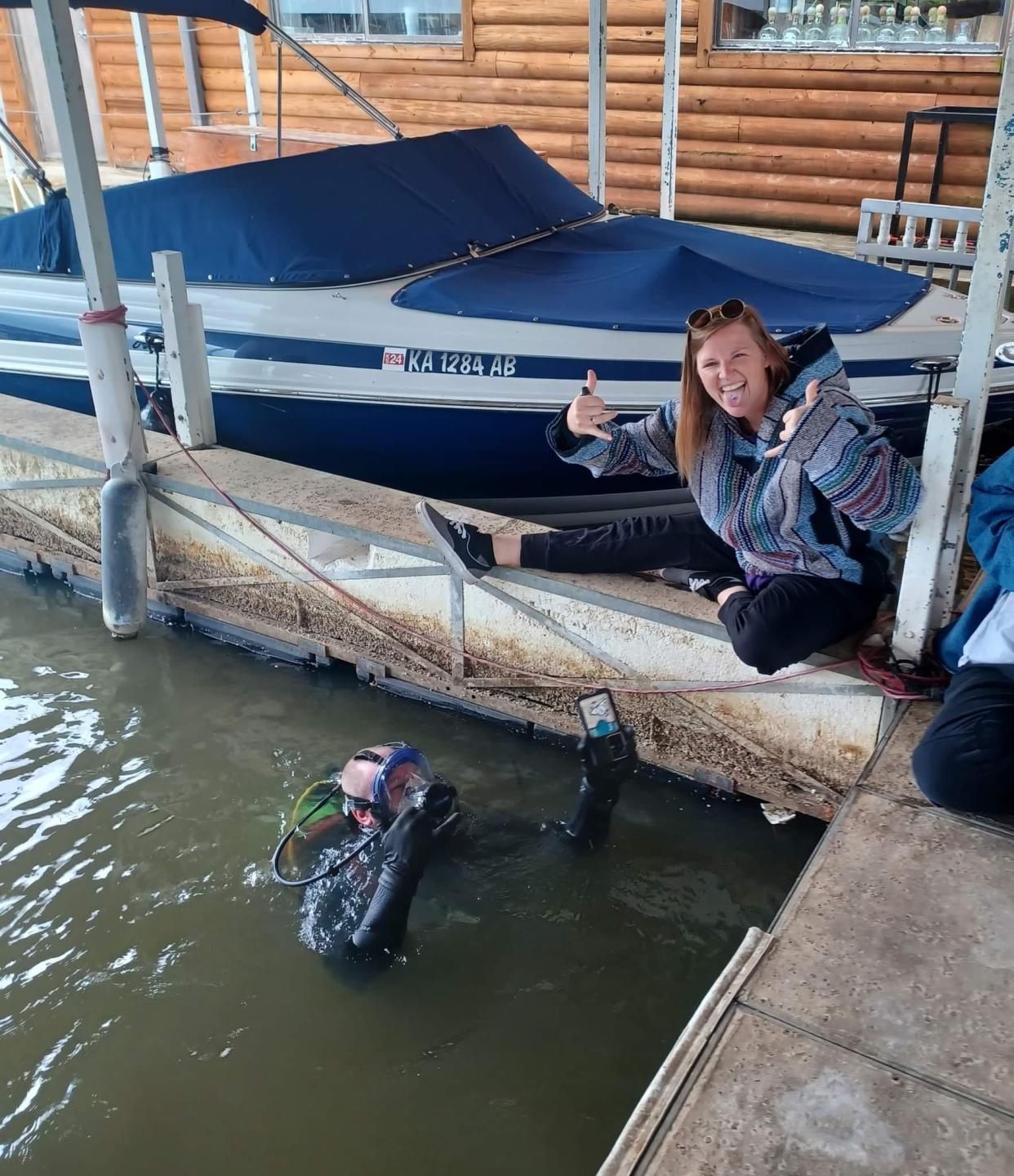 Diver Evan Thezan recovered Karrigan Coan's cell phone case containing her cellphone, driver's license and credit cards seven days after she accidentally dropped it in 19 feet of water at Perry Lake, northeast of Topeka.