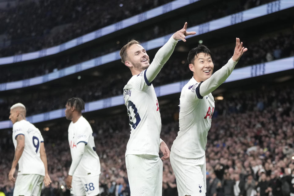 Tottenham's Son Heung-min, right, and Tottenham's James Maddison during the English Premier League soccer match between Tottenham Hotspur and Fulham at the Tottenham Hotspur Stadium in London, Monday, Oct. 23, 2023. (AP Photo/Kin Cheung)