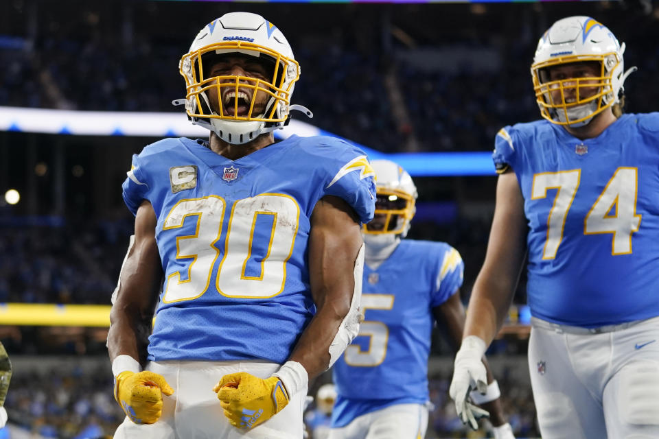 Los Angeles Chargers running back Austin Ekeler (30) reacts with teammates after scoring a touchdown during the second half of an NFL football game against the Pittsburgh Steelers, Sunday, Nov. 21, 2021, in Inglewood, Calif. (AP Photo/Ashley Landis)