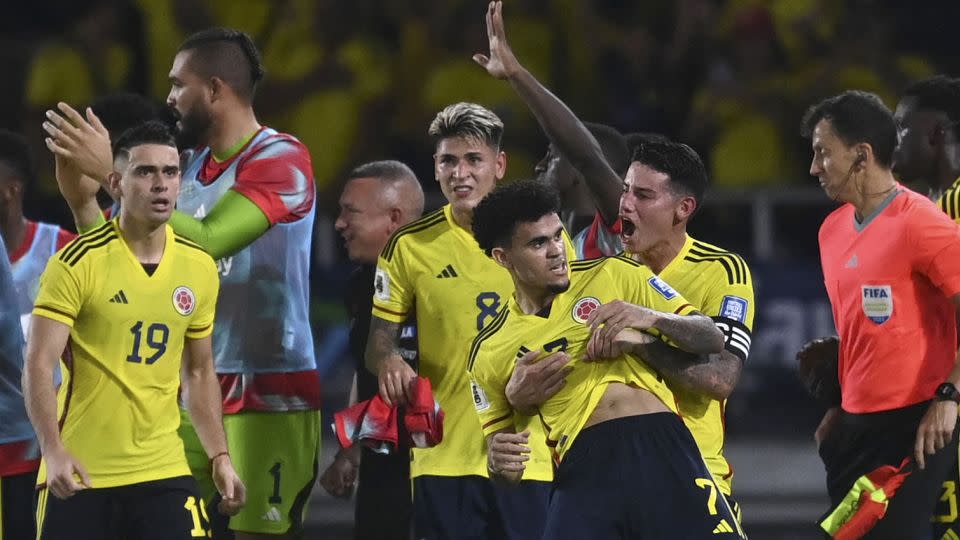 Colombia players celebrate with Luis Díaz after he scores against Brazil. - Juan Barreto/AFP/Getty Images
