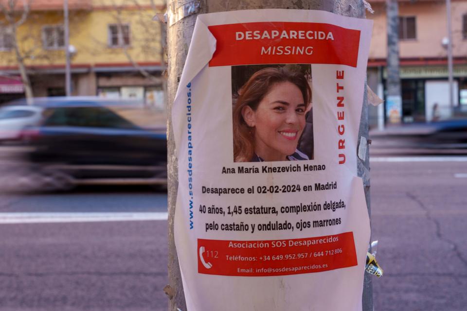 A banner of missing woman Ana Maria Knezevic, 40, is displayed on a streetlight in Madrid, Spain, Friday, Feb. 16, 2024. Spanish police are looking for the Colombian-born American woman who has been reported missing in Madrid since early February. A police spokeswoman said a friend filed a missing persons complaint in a Madrid city center station on Feb. 4.