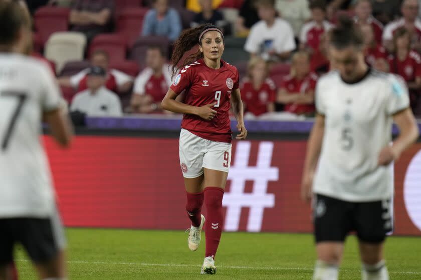 Denmark's Nadia Nadim runs during the Women Euro 2022 group B soccer match between Germany and Denmark at Brentford Community Stadium in London, Friday, July 8, 2022. (AP Photo/Alessandra Tarantino)