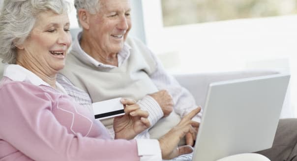 Senior couple shopping online