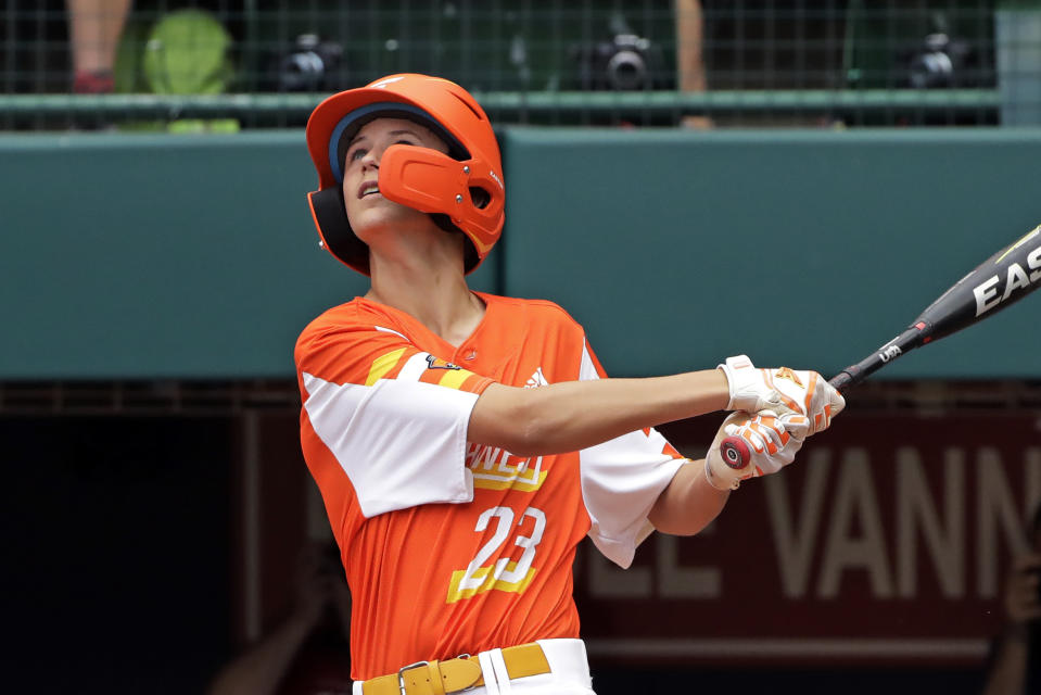 River Ridge, Louisiana's Marshall Louque drives in a run with a double off Curacao pitcher Keven Rosina during the third inning if the Little League World Series Championship game in South Williamsport, Pa., Sunday, Aug. 25, 2019. (AP Photo/Gene J. Puskar)