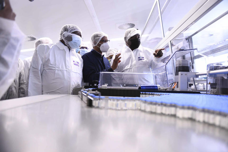 South African President Cyril Ramaphosa, right, heads a government delegation on a visit to ASPEN Pharmaceuticals in Port Elizabeth, South Africa, Monday, March 29, 2021. The World Health Organization says the continent of 1.3 billion people is facing a severe shortage of vaccine at the same time a new wave of infections is rising across Africa. (AP Photo)