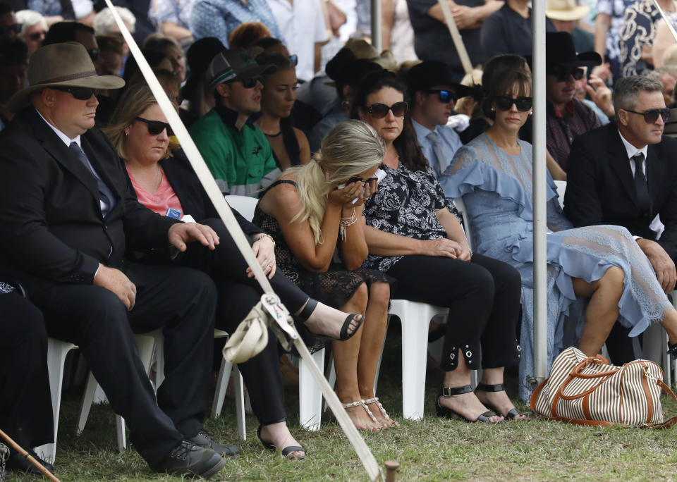 Patrick Salway's wife Renee (centre) is seen at his and Robert Salway's funeral on Friday. Source: AAP