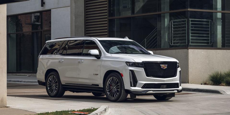 2023 cadillac escalade v in white parked in an alley