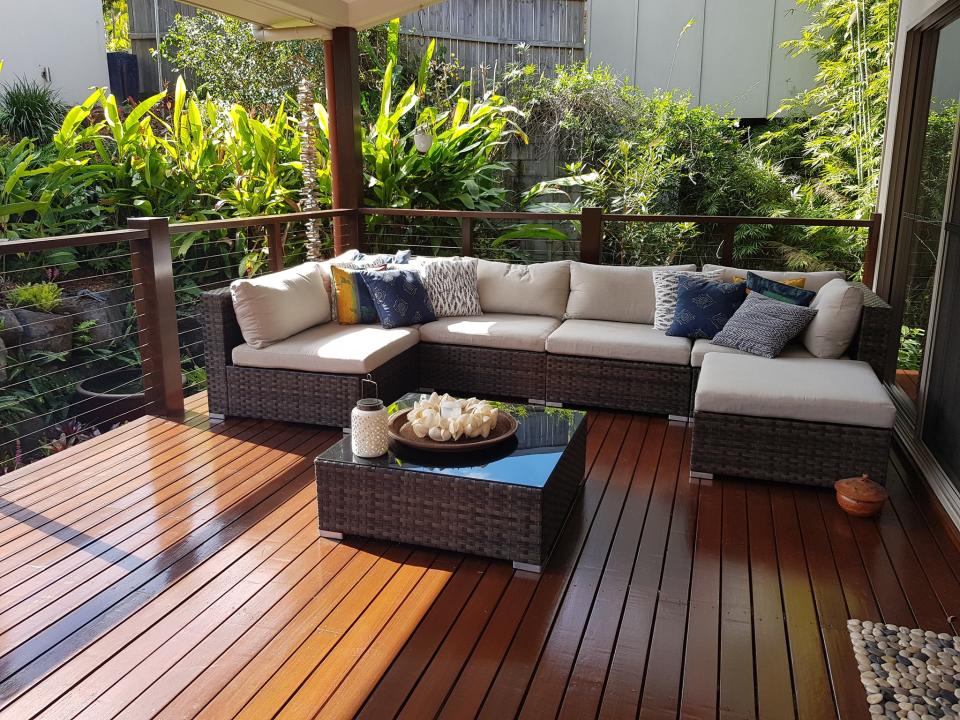 A sunny lounge on the back patio of a Sunshine Coast home is seen. A snake is hiding somewhere in the picture.