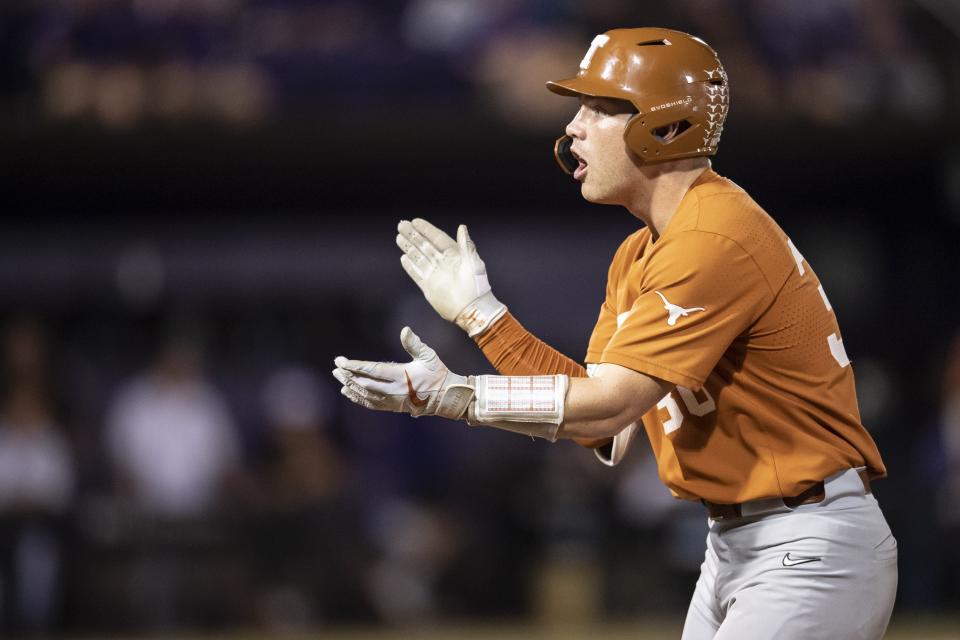 Texas' Eric Kenney celebrates a bunt single in the second inning of Sunday night's 11-1 win over East Carolina. The Longhorns lost Game 1 of the super regional but still made it back to Omaha by beating the Pirates back-to-back on Saturday and Sunday.