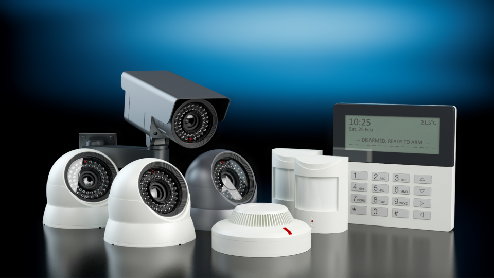 Some typical home security components including indoor cameras, outdoor camera, contact and environmental sensors and control panel - Kange Studio/iStockphoto