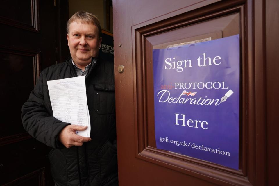 Harold Henning deputy grand master of the Grand Orange Lodge of Ireland holds signed copies of the declaration (Niall Carson/PA) (PA Wire)