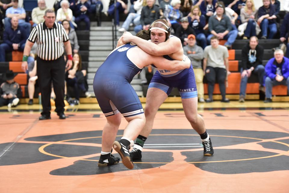 Richmond's Matt Misch (right) wrestles during a match earlier this season. He won the Division 3, Region 11 championship at 285 pounds on Feb. 18.