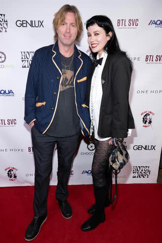 <p>Eugene Powers Photography</p> Elijah Blue with wife Queeny King (in a couture bow tie by Title of Work) at Hotel Ziggy on Feb. 5