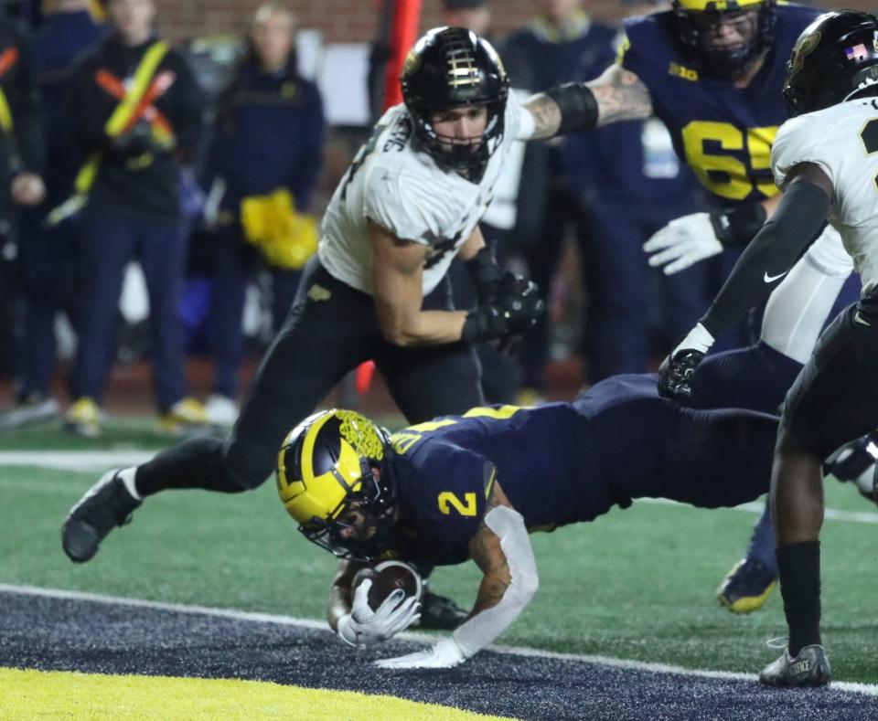 Michigan Wolverines running back Blake Corum scores a touchdown against the Purdue Boilermakers during the first half at Michigan Stadium, Saturday, Nov. 4, 2023.
