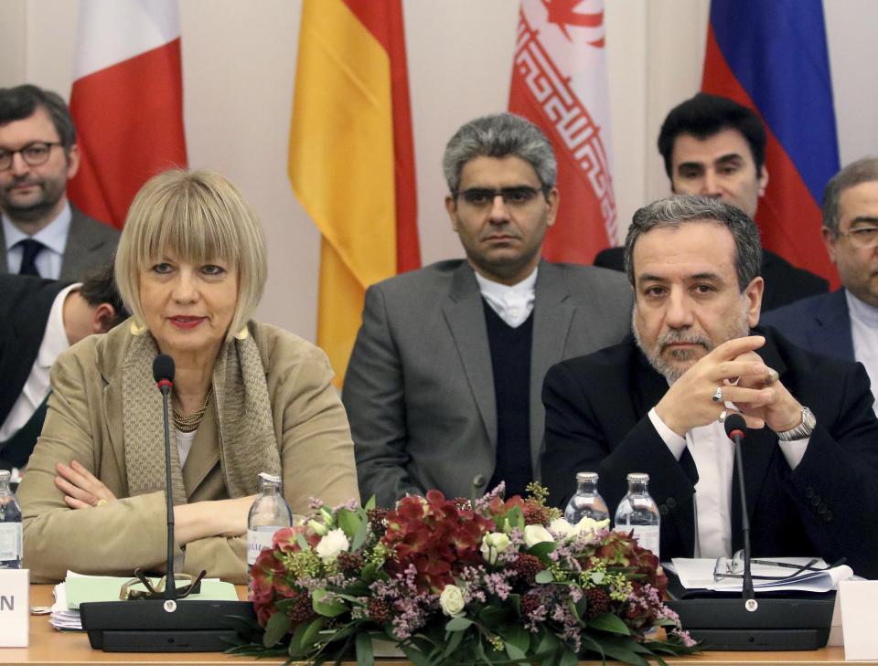 The European Union's political director Helga Schmid and Iran's deputy Foreign Minister Abbas Araghchi, from left, wait for a bilateral meeting as part of the closed-door nuclear talks with Iran in Vienna, Austria, Friday, Dec. 6, 2019. (AP Photo/Ronald Zak)