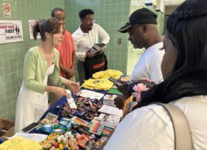 Parents in North Omaha listen to the pitch from Keep Kids First, which advocates for protecting Nebraska’s new Opportunity Scholarships Act. (Aaron Sanderford/Nebraska Examiner)