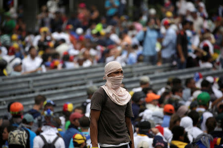 One of the opposition supporters reacts while clashing with security forces during a rally against Venezuela's President Nicolas Maduro in Caracas, Venezuela, April 26, 2017. REUTERS/Marco Bello