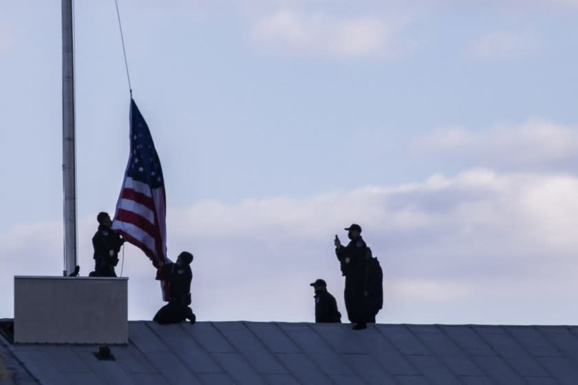 WASHINGTON, DC - APRIL 2: Capitol Police officers lower and replace the American flag to half staff over the U.S. Capitol to honor the Capitol Police officer that was killed in the line of duty earlier today on April 02, 2021 in Washington, DC. The U.S. Capitol was briefly locked down after a person reportedly rammed a vehicle into multiple Capitol Hill police officers. One officer was killed and one was wounded. The suspect, who exited the vehicle with a knife was fatally shot. (Photo by Samuel Corum/Getty Images)