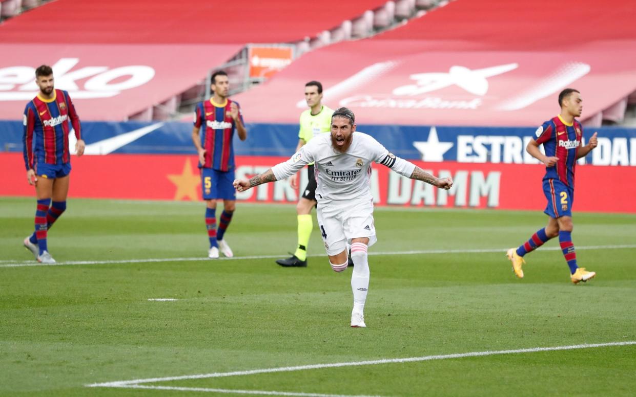 Sergio Ramos wheels away after converting his penalty - GETTY IMAGES