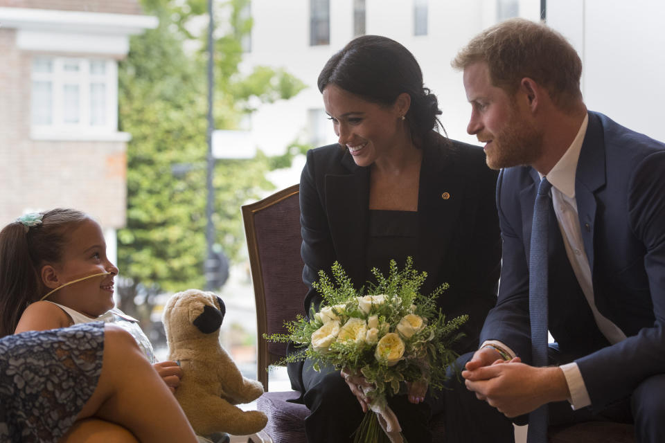 Harry and Meghan meeting Matilda Booth at the WellChild Awards last September [Photo: PA]