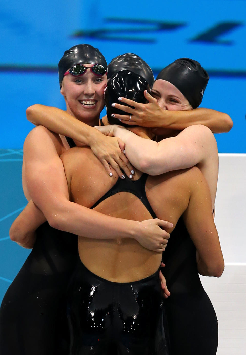 LONDON, ENGLAND - AUGUST 01: Shannon Vreeland (L), Missy Franklin (R), Allison Schmitt (C) and Dana Vollmer of the United States celebrate after they won the Final of the Women's 4x200m Freestyle Relay on Day 5 of the London 2012 Olympic Games at the Aquatics Centre on August 1, 2012 in London, England. (Photo by Alexander Hassenstein/Getty Images)